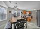 Cozy eat-in kitchen featuring tile floors and modern lighting at 849 Treva Anne Sw Dr, Concord, NC 28027