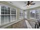 Bright sun room boasts a ceiling fan, many windows, and a glass exterior door at 849 Treva Anne Sw Dr, Concord, NC 28027