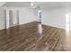 Large bedroom with laminate flooring and access to bathroom at 8835 Merrie Rose Ave, Charlotte, NC 28213