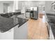 Kitchen boasts dark granite countertops and stainless steel appliances at 8835 Merrie Rose Ave, Charlotte, NC 28213