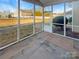 Screened porch overlooking a fenced backyard at 8835 Merrie Rose Ave, Charlotte, NC 28213