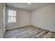 Well-lit bedroom with wood-look floors and a window at 100 Howell St # 13A, Hickory, NC 28601