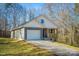 Gray house with white accents, a dark door, and a light-colored porch at 100 Howell St # 13A, Hickory, NC 28601