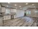 Open living room and kitchen with vaulted ceilings and gray flooring at 100 Howell St # 13A, Hickory, NC 28601