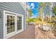 Spacious backyard deck with an outdoor dining area, providing serene views of the landscape at 10105 Bon Meade Ln, Cornelius, NC 28031