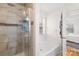 Bright bathroom with a glass-enclosed shower and a separate soaking tub at 10105 Bon Meade Ln, Cornelius, NC 28031