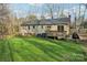 Rear exterior view showing a wooden deck, well-kept lawn and mature landscaping at 1025 Twin Lakes Rd, Rock Hill, SC 29732