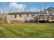 Spacious backyard featuring lush green grass, a wooden fence and deck at 1025 Twin Lakes Rd, Rock Hill, SC 29732