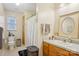 Classic bathroom with oak vanity, storage, and a shower with curtain, providing a functional and comfortable space at 1025 Twin Lakes Rd, Rock Hill, SC 29732