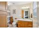 Bright bathroom featuring a wood vanity, neutral walls, toilet and shower with curtain at 1025 Twin Lakes Rd, Rock Hill, SC 29732