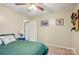 Comfortable bedroom with a ceiling fan, neutral walls, and a blue nightstand, creating a relaxing retreat at 1025 Twin Lakes Rd, Rock Hill, SC 29732