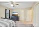 Bedroom featuring carpeted floors, ceiling fan, dresser with TV and two closet doors at 1025 Twin Lakes Rd, Rock Hill, SC 29732