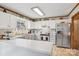 Clean kitchen with white cabinets and stainless steel appliances, offering a functional and stylish cooking space at 1025 Twin Lakes Rd, Rock Hill, SC 29732