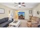 Cozy living room featuring comfortable seating and a media center with a large TV at 1025 Twin Lakes Rd, Rock Hill, SC 29732