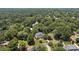 Estate aerial view revealing the setting amid a lush, dense forest surrounding the property at 110 Lynbrook Dr, Davidson, NC 28036