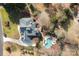 Aerial view of a property featuring a well-maintained home, pool, and beautifully landscaped yard at 110 Lynbrook Dr, Davidson, NC 28036