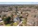 Spacious property showcasing a beautifully landscaped home with pool, patio area, and mature surrounding trees at 110 Lynbrook Dr, Davidson, NC 28036