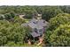 An aerial view of the screened in porch and lush backyard landscaping surrounding the residence and neighborhood at 110 Lynbrook Dr, Davidson, NC 28036