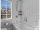 Bright bathroom with shower/tub and white tile at 110 Lynbrook Dr, Davidson, NC 28036