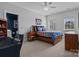 Cozy bedroom with carpeted floors, a ceiling fan, and natural light at 110 Lynbrook Dr, Davidson, NC 28036