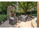 Cozy outdoor living area with a stone fireplace and comfortable seating perfect for gathering at 110 Lynbrook Dr, Davidson, NC 28036