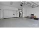 Spacious garage with epoxy floors and custom storage cabinets at 110 Lynbrook Dr, Davidson, NC 28036