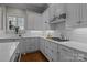 Bright kitchen with white cabinets and a herringbone backsplash at 110 Lynbrook Dr, Davidson, NC 28036