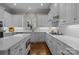 Well-lit kitchen with white cabinets and stainless steel appliances at 110 Lynbrook Dr, Davidson, NC 28036