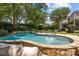 Lounge by the pool and enjoy the meticulously landscaped backyard with mature trees at 110 Lynbrook Dr, Davidson, NC 28036