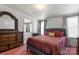 Bedroom with a large bed, dresser, and ensuite bathroom at 111 Green Dr, Richburg, SC 29729