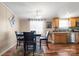 Dining area with a wood table and chairs, hardwood floors, and kitchen access at 111 Green Dr, Richburg, SC 29729