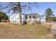 Side view of a white doublewide home with blue shutters and a covered porch at 111 Green Dr, Richburg, SC 29729