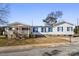 White doublewide home with blue shutters, a covered porch, and a landscaped yard at 111 Green Dr, Richburg, SC 29729