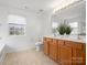 Bathroom featuring a double vanity, tile flooring, and a window at 1115 Ross Brook Trce, York, SC 29745