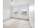 Bright bedroom with white walls, carpet, and two windows offering ample natural light at 1115 Ross Brook Trce, York, SC 29745