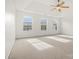 Spacious bedroom with a ceiling fan, three windows, and neutral carpeting at 1115 Ross Brook Trce, York, SC 29745