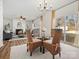 Casual dining area with wicker chairs and a view into the living room and backyard at 1115 Ross Brook Trce, York, SC 29745