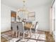 Formal dining room featuring a wood table, gray chairs, and chandelier at 1115 Ross Brook Trce, York, SC 29745