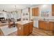 Kitchen with wooden cabinets, an island, and stainless steel appliances at 1115 Ross Brook Trce, York, SC 29745