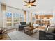 Open concept living space with gray sofas, a coffee table, and kitchen views at 1115 Ross Brook Trce, York, SC 29745