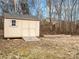 Backyard storage shed with double doors and ramp, adjacent to cleared garden bed area at 1115 Ross Brook Trce, York, SC 29745