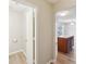 Hallway view into the nearby kitchen area with island and breakfast bar at 12218 Stewarts Crossing Dr, Charlotte, NC 28215