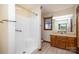 Bathroom featuring a shower stall and wood vanity at 1308 Gum Branch Rd, Charlotte, NC 28214