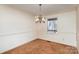 Simple dining room with carpet and chandelier at 1308 Gum Branch Rd, Charlotte, NC 28214