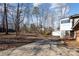 Rear view of house with detached garage and yard at 1308 Gum Branch Rd, Charlotte, NC 28214