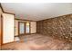 Living room with floral wallpaper and access to deck at 1308 Gum Branch Rd, Charlotte, NC 28214