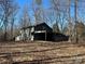 Detached outbuilding with covered carport area at 1308 Gum Branch Rd, Charlotte, NC 28214