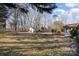 Large backyard with shed and trees at 1318 Gum Branch Rd, Charlotte, NC 28214