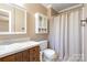 Simple bathroom with shower and storage cabinet at 1318 Gum Branch Rd, Charlotte, NC 28214