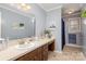 Clean bathroom with updated vanity and shower at 1318 Gum Branch Rd, Charlotte, NC 28214